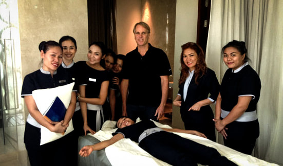 Julian Eymann with staff at resort spa after training day on advanced trigger point massage techniques